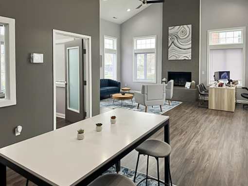 an open living room and dining room with a white table
