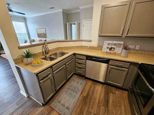 Designer kitchen featuring wood cabinets and stainless appliances