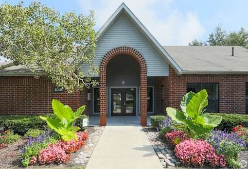 A building with a brick facade and a large arched entrance.