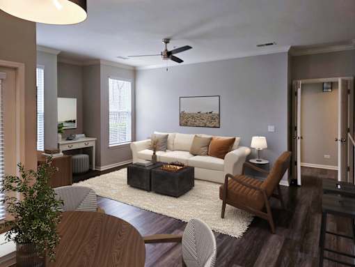 Bright living room showcasing comfortable seating and ceiling fan