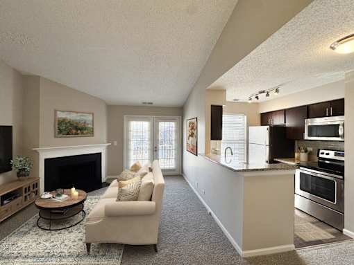 A living room with a fireplace and a couch.