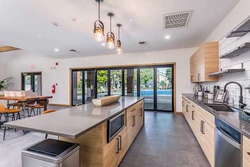 A modern kitchen with wooden cabinets and stainless steel appliances.