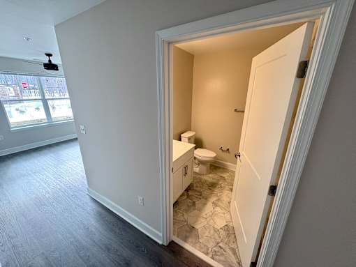 A bathroom with a toilet and sink is shown.