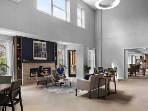a rendering of a living room with a fireplace and people in it
