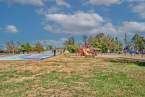a playground in a park on a sunny day