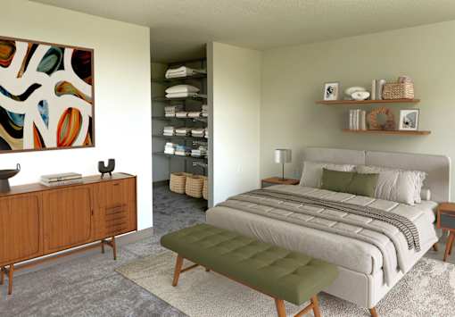 A bedroom with a large bed and a wooden cabinet.