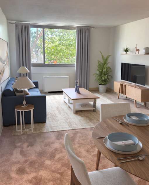 A modern living room with a blue sofa, wooden coffee table, and a television.