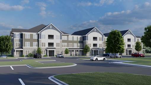 A rendering of a modern apartment complex with cars parked in the driveway.