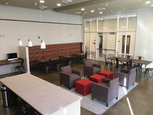 A room with a long table and chairs.