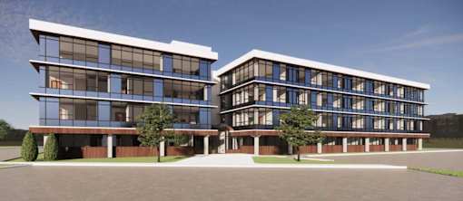 A modern two-story building with large windows and a flat roof.