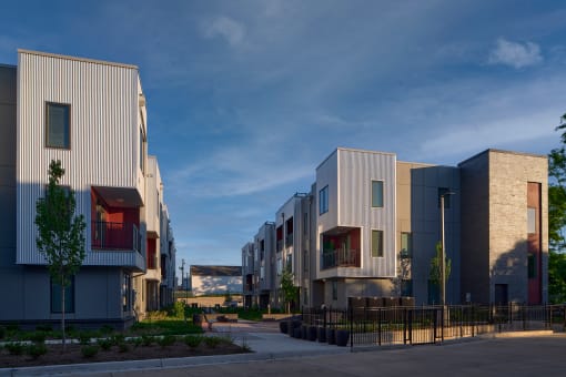 a row of multifamily buildings on a city street