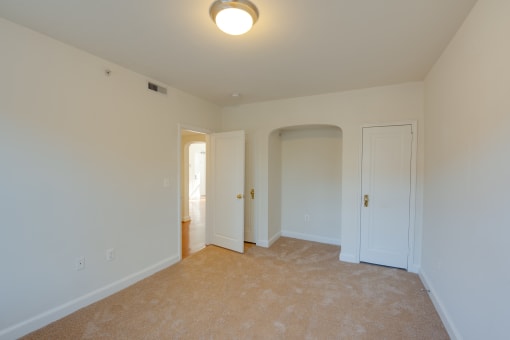 carpeted bedroom and closet