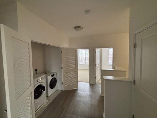 A laundry room with a washer and dryer in it.