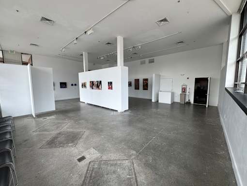 A large white room with a white wall and a white floor.