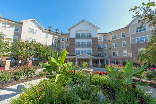A large building with a garden in front of it.