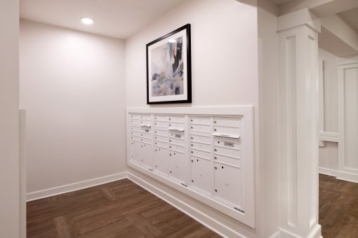 a row of white chests of drawers in a white room