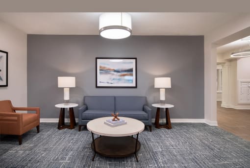 a living room with a blue couch and a coffee table