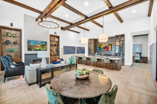a large room with a table and tv