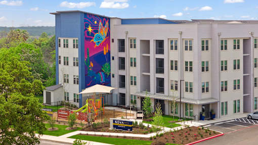 A large building with a mural on the side of it.