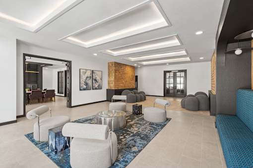 Leasing office lobby with reception desk, chairs and waiting area at Aviator 1518.