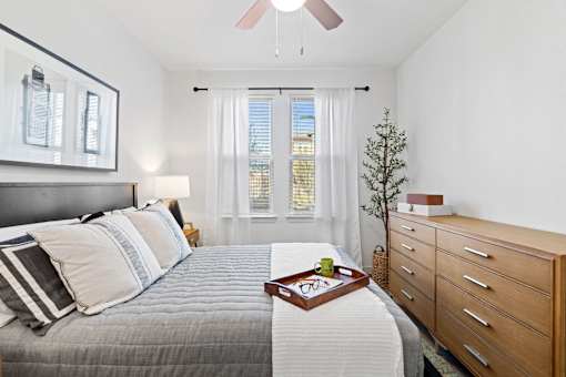 a bedroom with a bed and a dresser