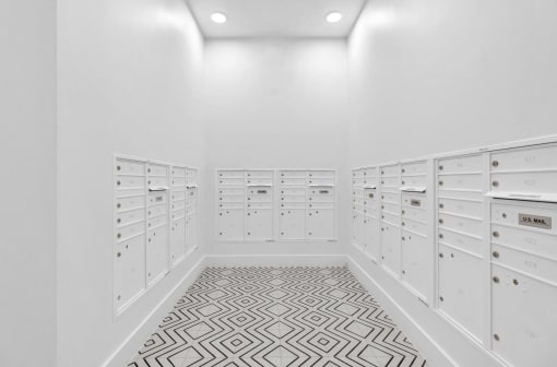 the walk in closet has plenty of drawers and lockers