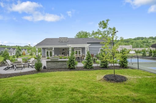 a backyard with a pool and a house