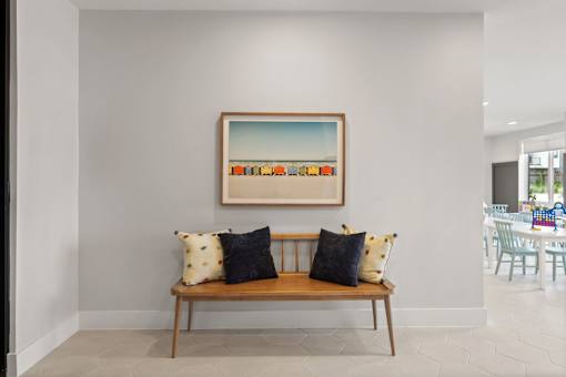 Resident common area with casual seating, colorful artwork, and warm, welcoming design elements.
