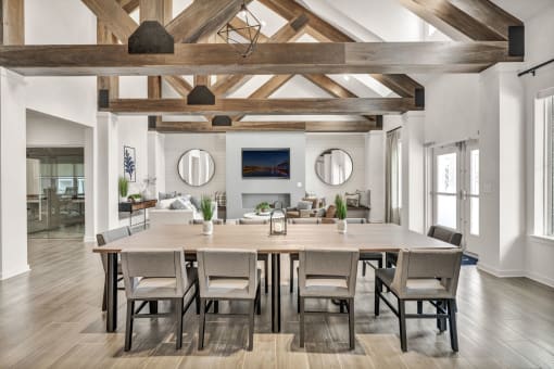 a room with a large table and chairs