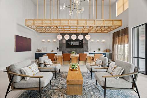 Apartment community amenity space highlighting stylish gathering areas, modern design elements, and comfortable resident accommodations.