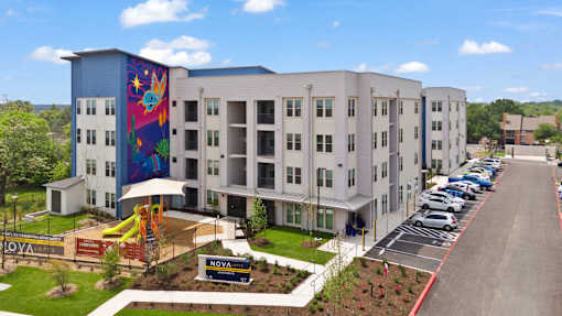 A modern building with a colorful mural on the side.
