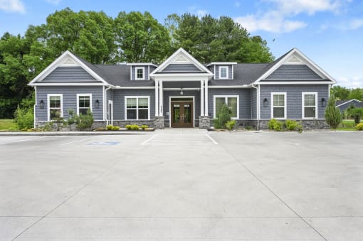 a large driveway in front of a clubhouse