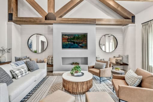 a room with couches and chairs and a table