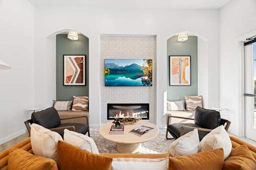 a room with couches and a fireplace