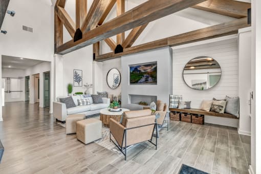 a room with couches and chairs and a fireplace