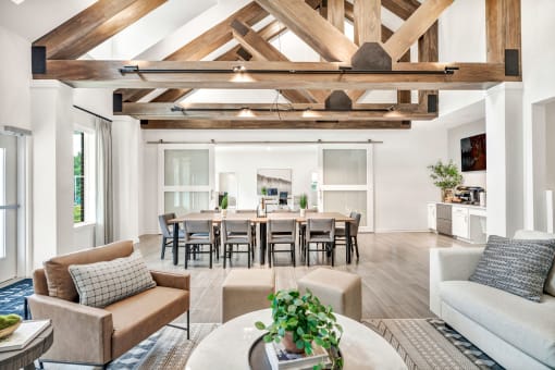 a room with a large table and chairs
