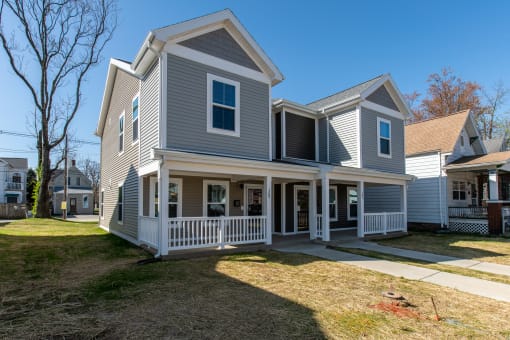 a with a porch and a yard
