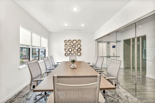 a conference room with a wooden table and chairs