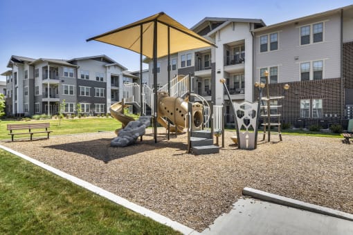 a playground with building in the background
