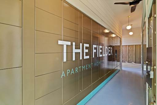 Resident package and mail center featuring secure parcel lockers and centralized mail services for convenient package retrieval