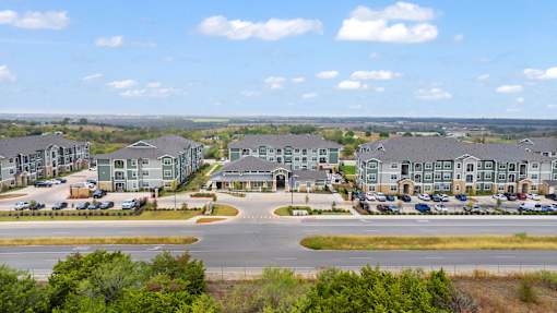 A large housing development with a roundabout in the foreground.