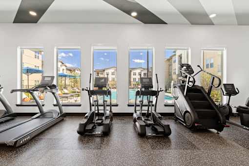 the gym with treadmills and ellipticals at the flats at 3600 apartments