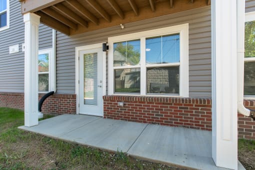 the front porch of a home with a ramp to the door