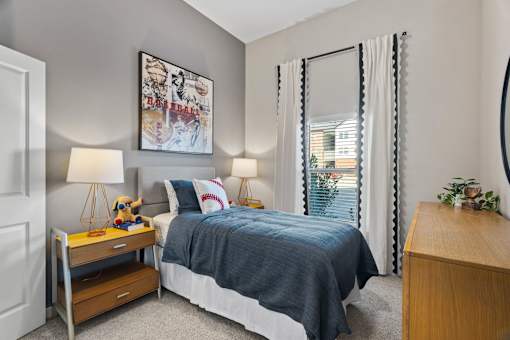 Secondary bedroom featuring contemporary furnishings, ample storage, and comfortable accommodations for residents or guests.