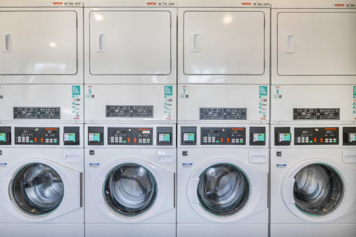 a row of washing machines in a public laundromat