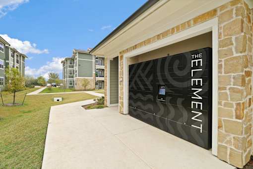 A building with a garage door that says "Element".
