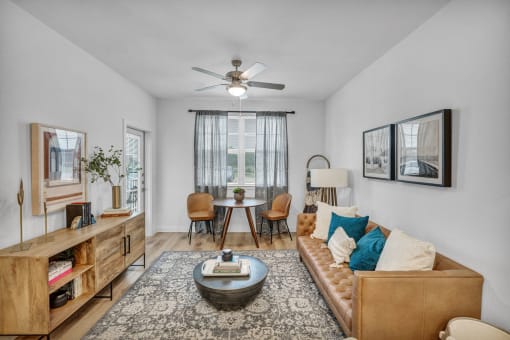 a living room with a couch and chairs