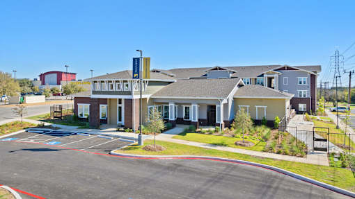 an apartment building with a parking lot
