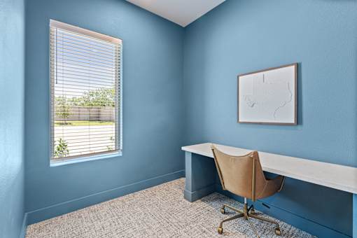 Business center with private work pods and shared workspace at The Esther.