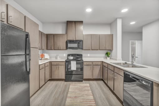 a kitchen with wooden cabinets and stainless steel appliances